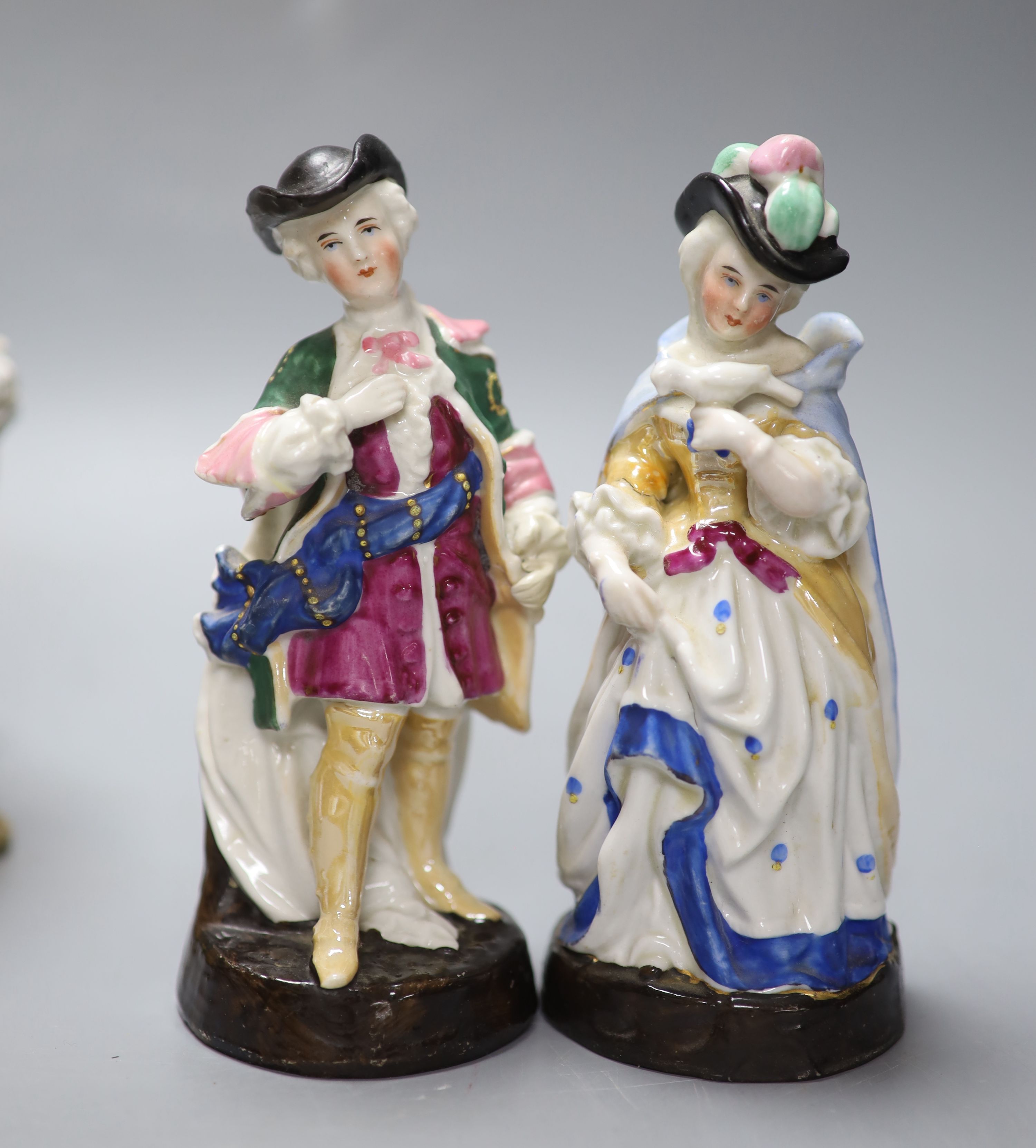 A Dresden porringer and three Continental porcelain figure groups, tallest 21cm